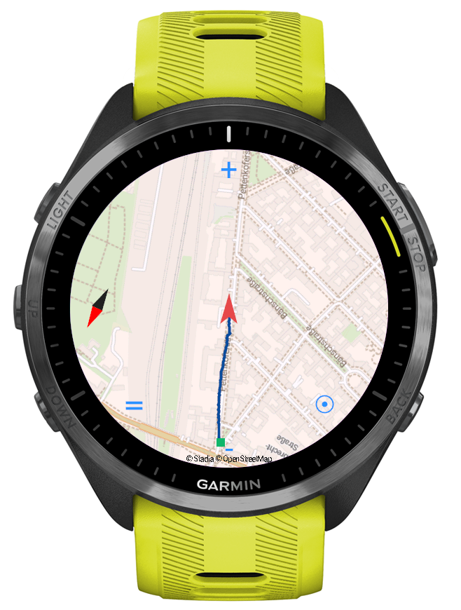 A Garmin watch showing a detailed street map, with the wearer's
                   position and a track marked on it.